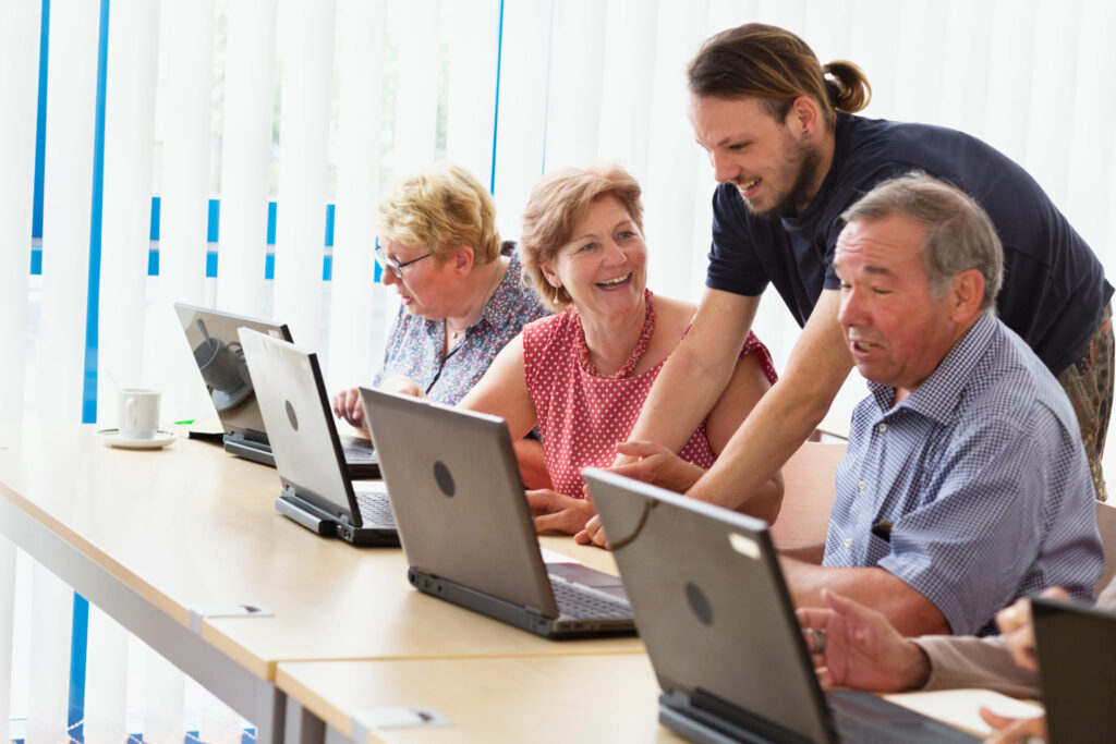 senior adults learning in computer lab